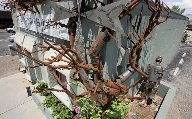 Tucson Oddity: Gnarled metal 'tree' takes firm root at piercing studio